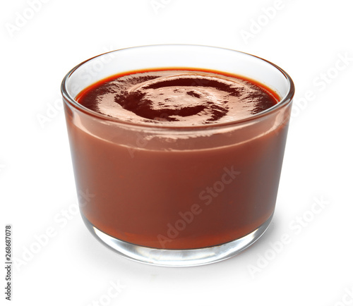 Glass dish of barbecue sauce on white background