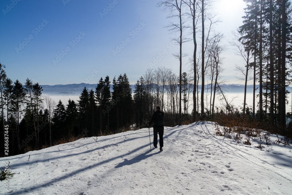 Hiking man in Nature and forest covered in snow during deep cold winter. Slovakia Hiking man in Nature and forest covered in snow during deep cold winter. Slovakia