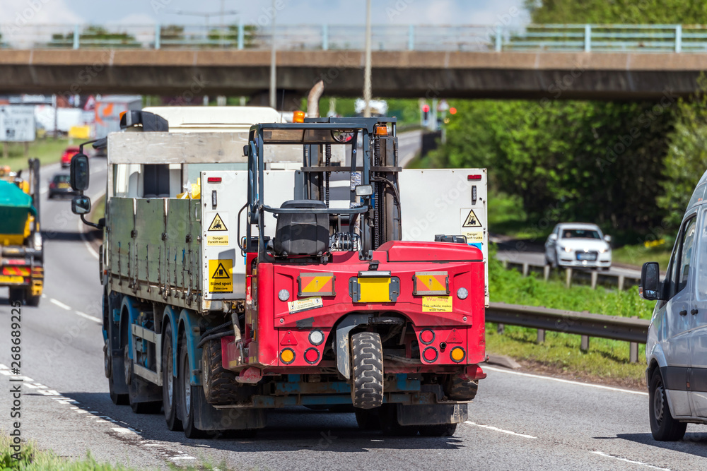 moffet lorry truck with forklift on uk motorway in fast motion moffet lorry truck with forklift on uk motorway in fast motion