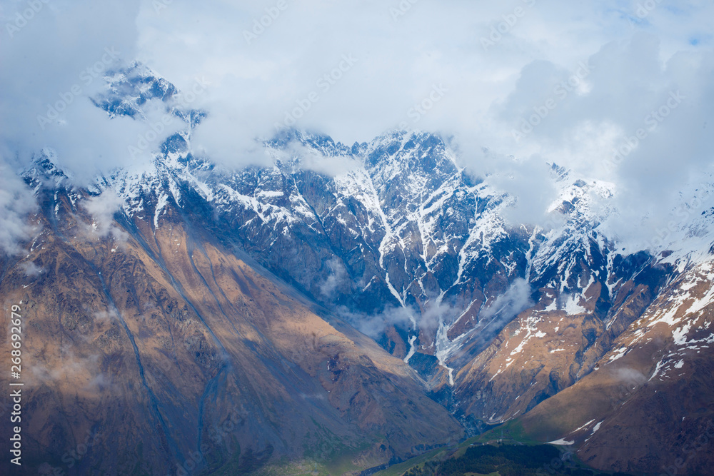 Obraz premium amazing view of the mountain peaks in the clouds