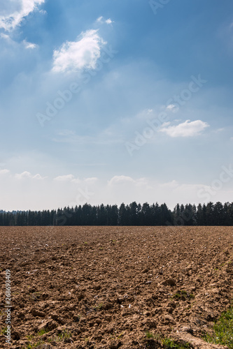 Big fields in the middle of the german countryside with hills, forests and meadows