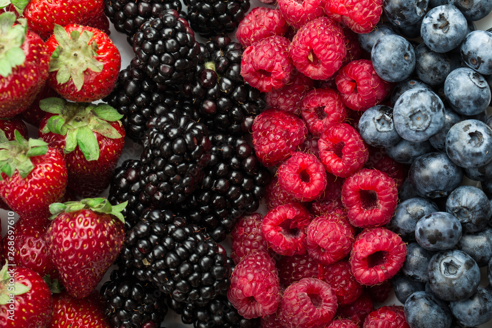 Fresh Summer Berries mix Background with Strawberry, Raspberry, Red currant, Blueberry and Blackberry. Fresh Summer Berries mix Background with Strawberry, Raspberry, Red currant, Blueberry and Blackberry.