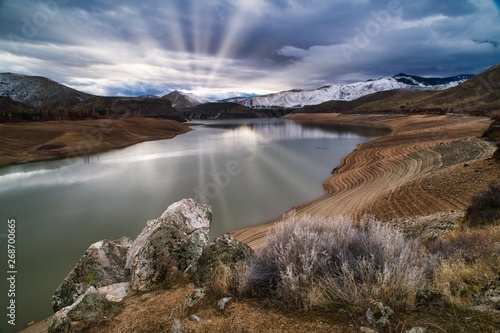 sunrays over lucky peak reservoir near boise idaho