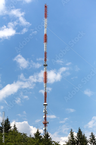 radio tower antenna in front of blue sky