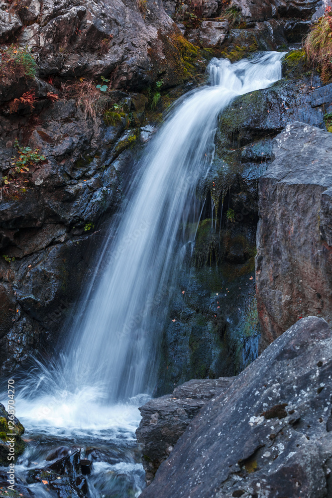 Fototapeta premium Gveleti Big Waterfalls in a Dariali Gorge near the Kazbegi city in the mountains of the Caucasus, Geprgia
