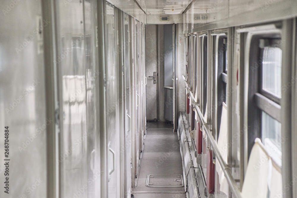 Naklejka premium Empty corridor in the train car. Close up