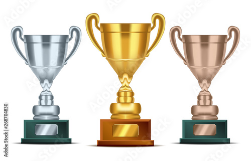 Realistic Golden, silver and bronze Trophy with text plate for champions. Sport winners cup. Vector Illustration