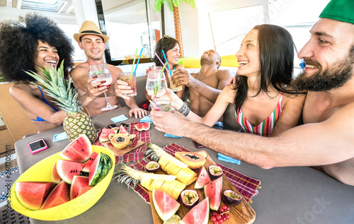 Photography Happy friends drinking fancy cocktails at boat party trip - Young millenial peop