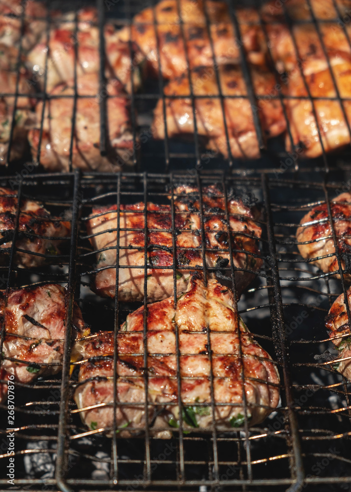 grilled pork are cooked outdoors; summer picnic; close-u