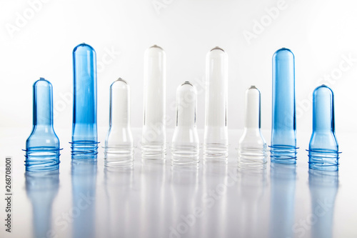 The various type of plastic bottle product and preform material with white background