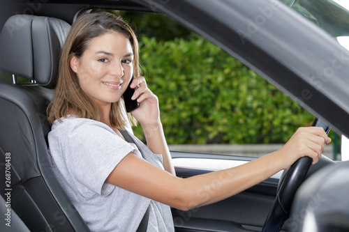beautiful woman talking on phone while driving © auremar