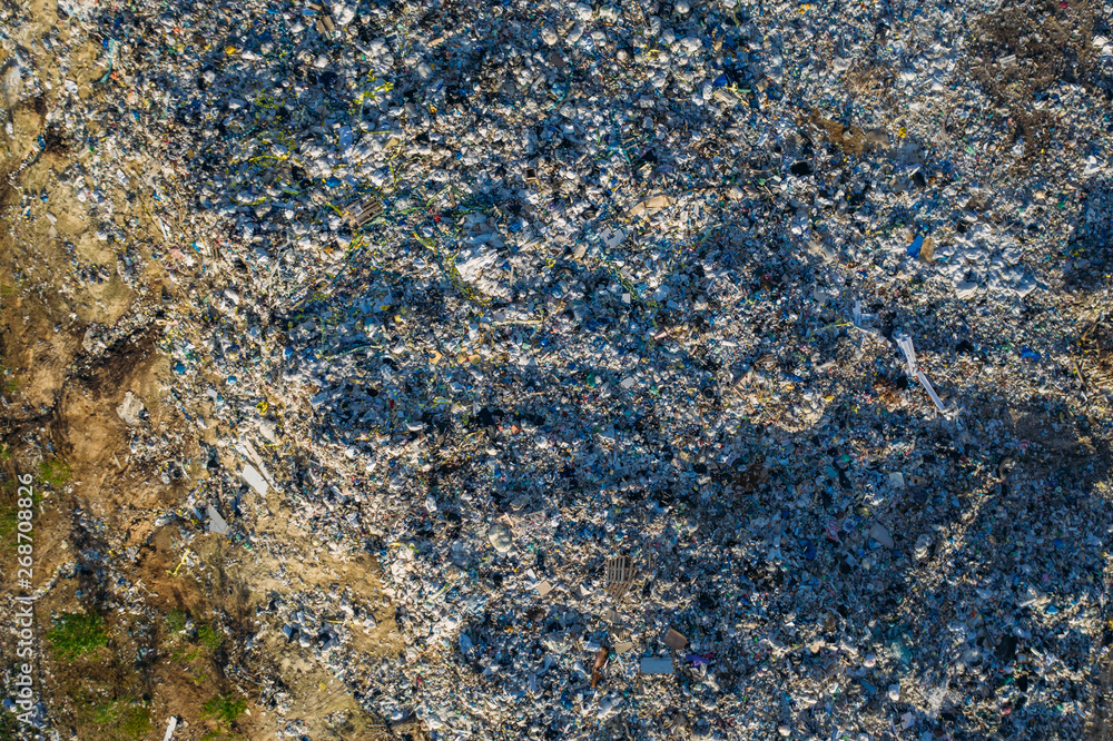 Aerial view of garbage dump. Top view of plastic waste and different trash