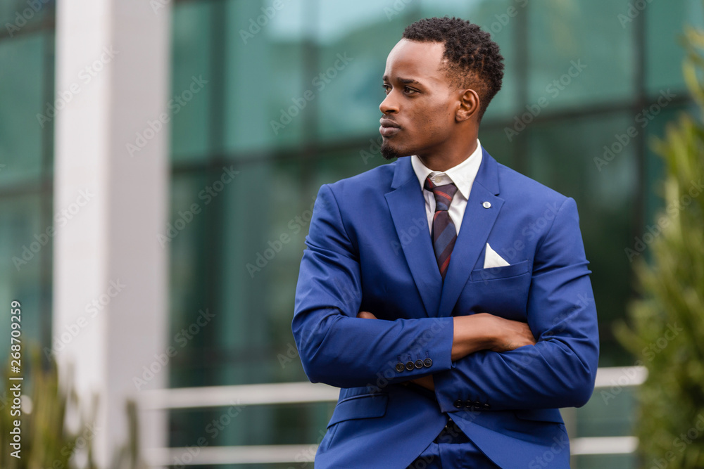 Outdoor standing portrait of a black African American business man Outdoor standing portrait of a black African American business man