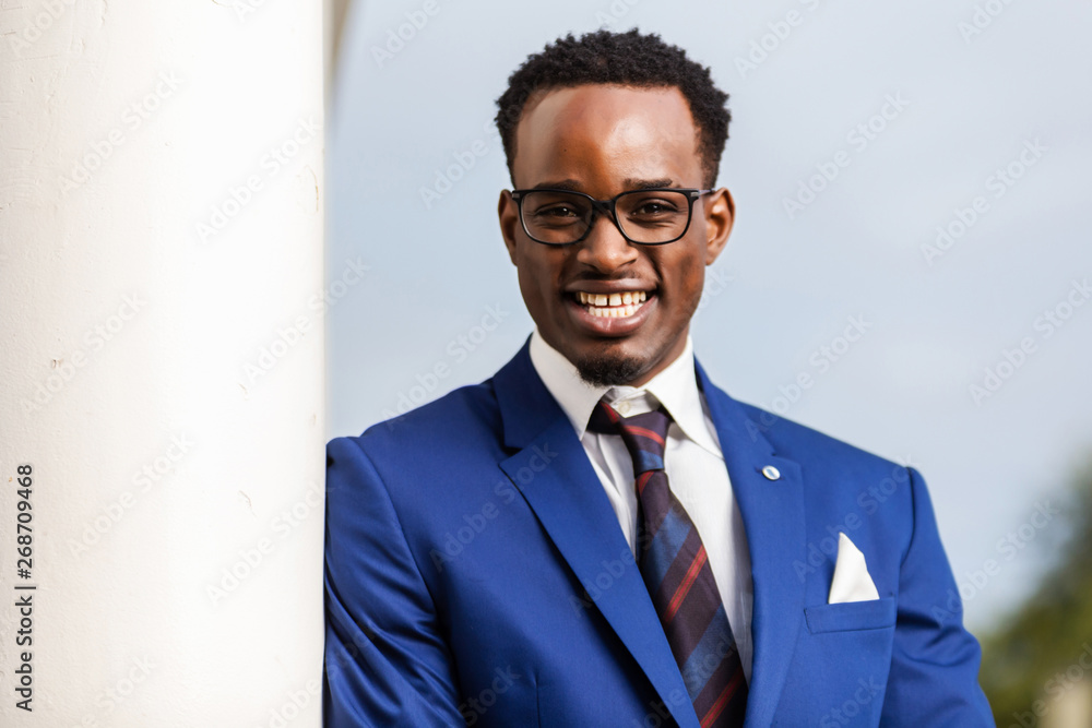 Outdoor standing portrait of a black African American business man