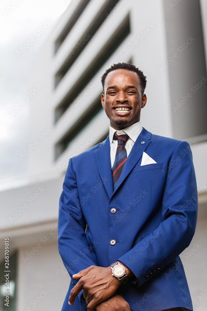 Outdoor standing portrait of a black African American business man Outdoor standing portrait of a black African American business man