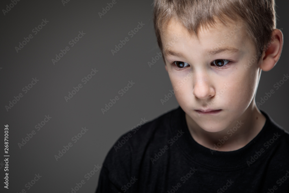 Grief-stricken little boy - feeling intense sorrow, remorse, sadnesss - studio portrait - vivid emotions series Grief-stricken little boy - feeling intense sorrow, remorse, sadnesss - studio portrait - vivid emotions series