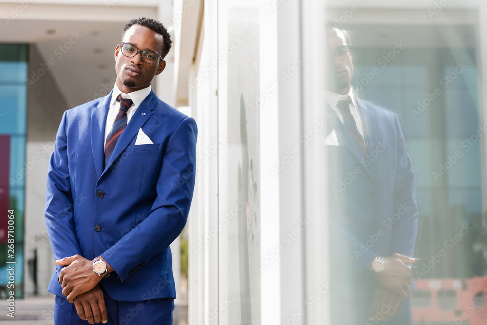 Outdoor standing portrait of a black African American business man Outdoor standing portrait of a black African American business man