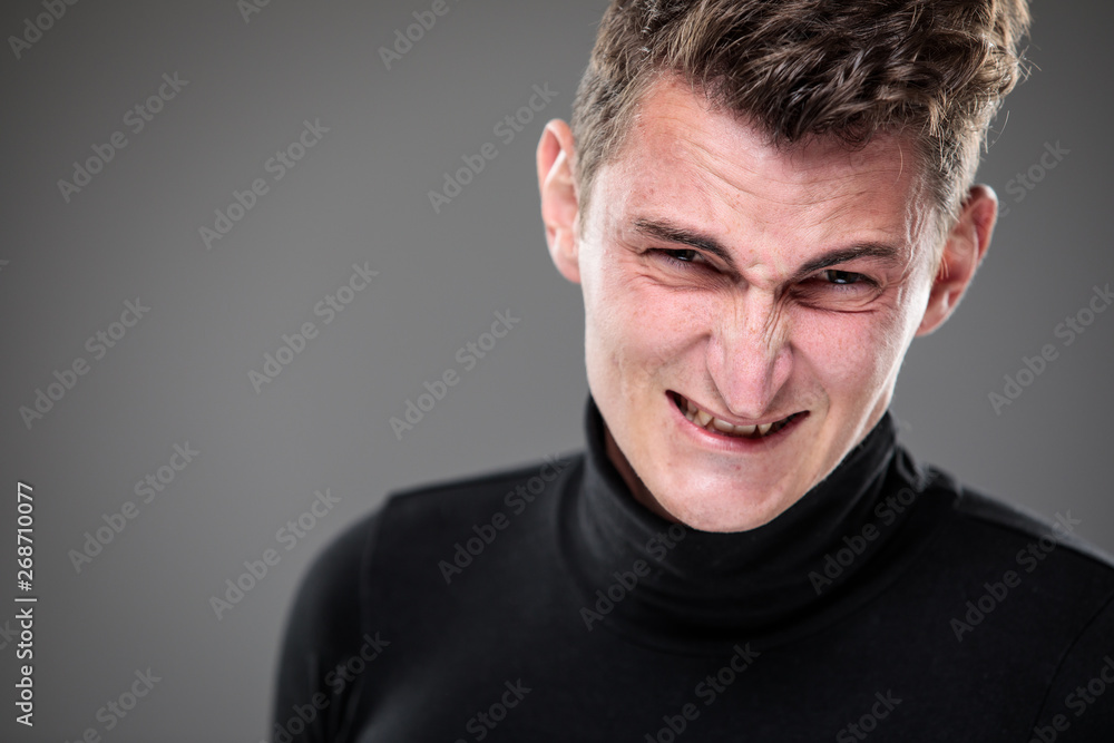 Fear/anxiety/regret/uncertainty in a young man - effects of a difficult life situation - vivid emotions concept Fear/anxiety/regret/uncertainty in a young man - effects of a difficult life situation - vivid emotions concept