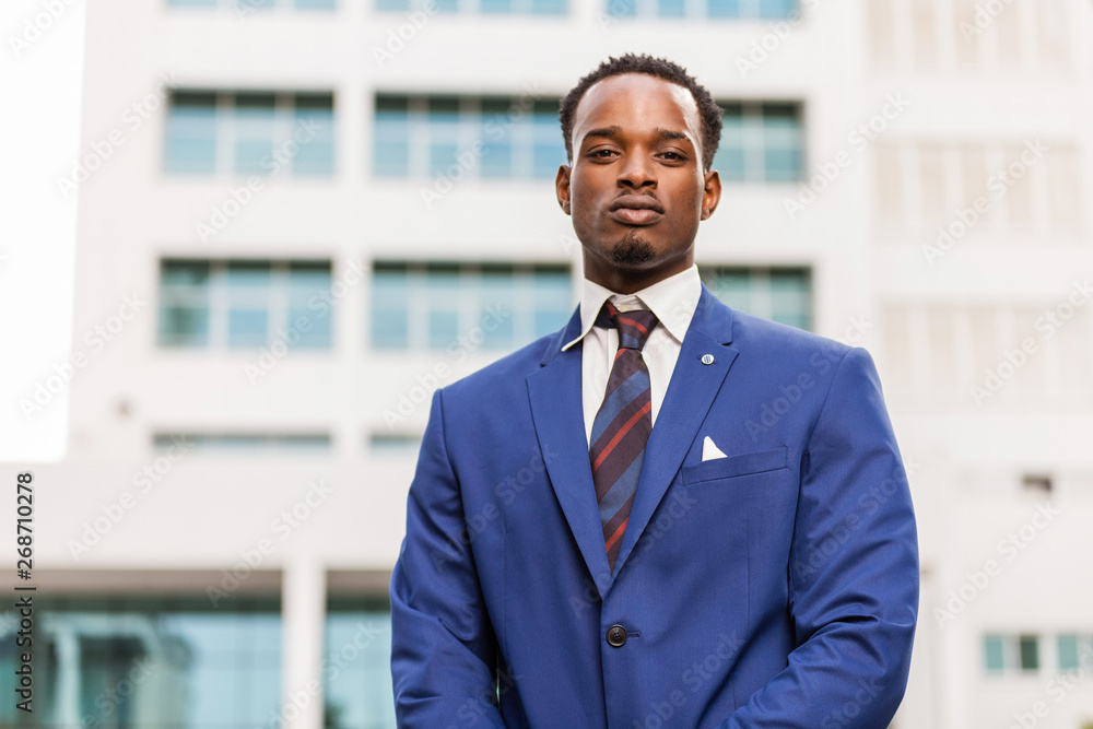 Outdoor standing portrait of a black African American business man Outdoor standing portrait of a black African American business man