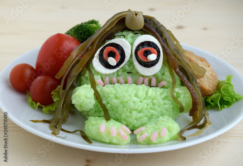 The monster is made of rice. Kyaraben, bento. Creative food for children. photo