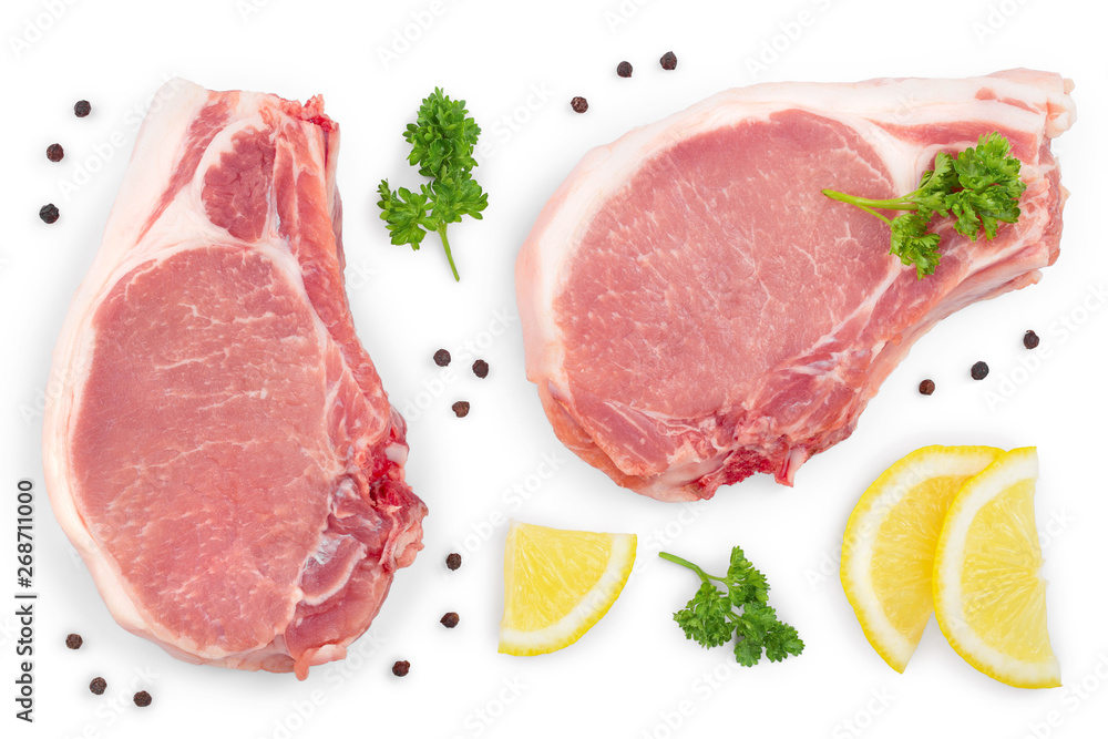 sliced raw pork meat with parsley and lemon isolated on white background. Top view. Flat lay sliced raw pork meat with parsley and lemon isolated on white background. Top view. Flat lay