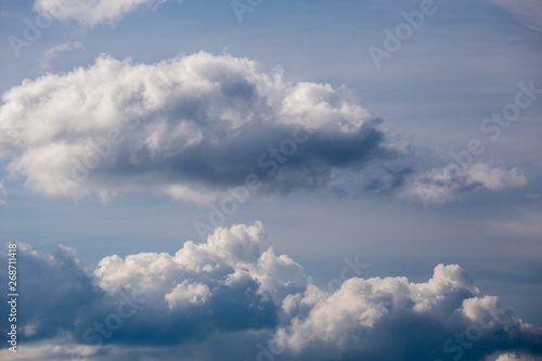 Obraz na plátně Regular spring clouds on blue sky at daylight in continental europe