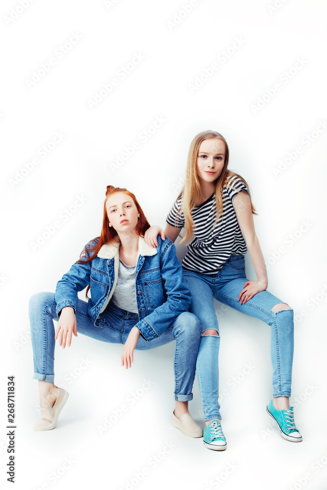 two best friends teenage girls together having fun, posing emotional on white background, besties happy smiling, making selfie, lifestyle people concept two best friends teenage girls together having fun, posing emotional on white background, besties happy smiling, making selfie, lifestyle people concept