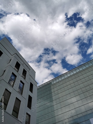 building with blue sky and clouds