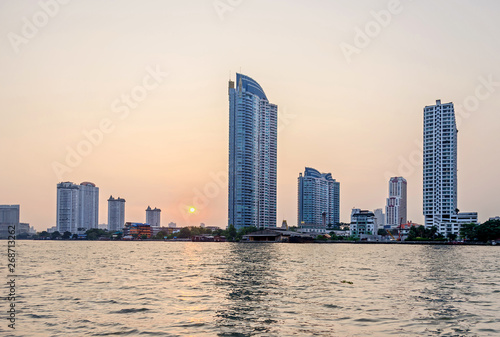 Skyline of Bangkok  at the banks of the Chao Phraya River at sunset © laranik