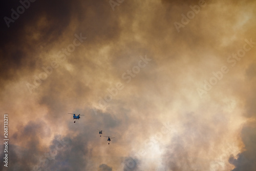 military helicopters putting out wildfires © Cody