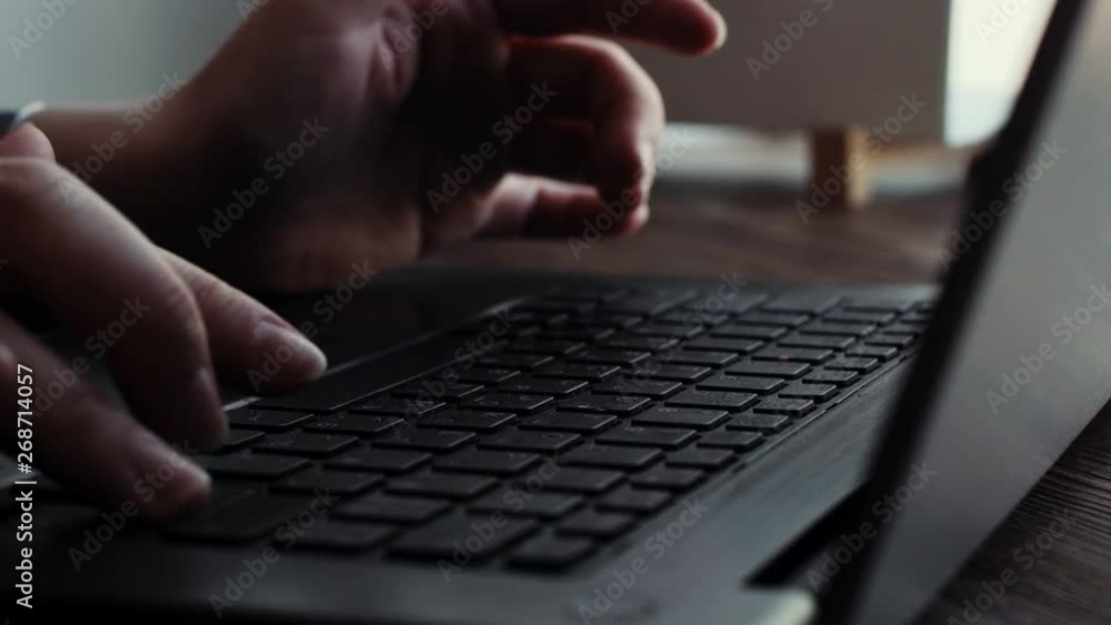 Hands of young business woman typing on a laptop keyboard closeup in the cafe. Hands of a girl with well-groomed nails begins to type text on the keyboard of a laptop close up Hands of young business woman typing on a laptop keyboard closeup in the cafe. Hands of a girl with well-groomed nails begins to type text on the keyboard of a laptop close up