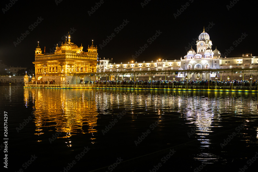 Night view to the Golden temple (Harmandir sahib) with reflection in