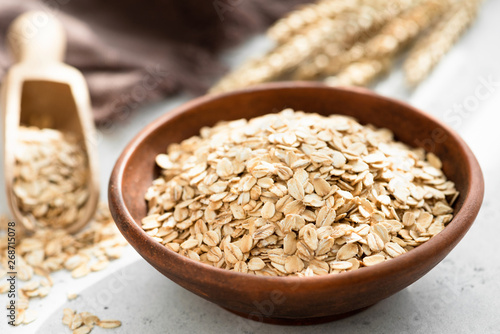 Oat flakes, rolled oats in bowl. Dry breakfast cereals. Healthy eating, healthy lifestyle concept