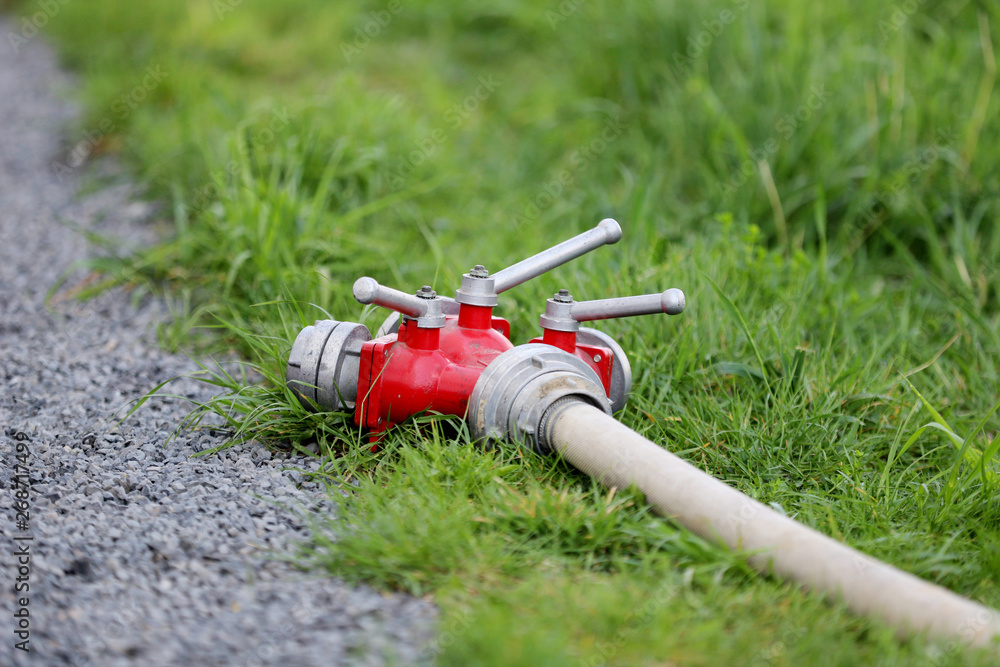 Naklejka premium portable hydrant with a hose