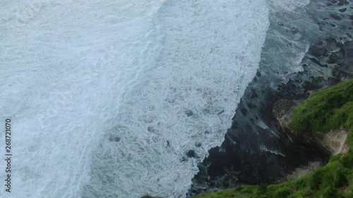 Top view of the giant waves, foaming and splashing in the ocean Bali, Indonesia