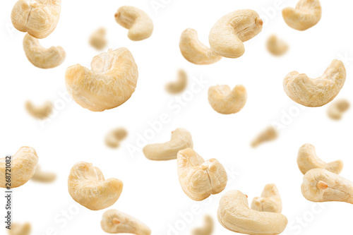 Falling cashew nut isolated on white background, selective focus