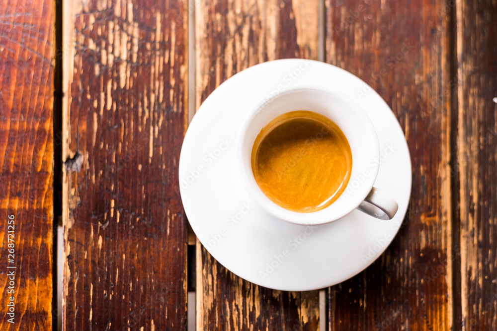 Coffee cup top view on wooden table background. Coffee cup top view on wooden table background.
