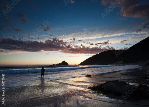 fisherman on beach in big sur california