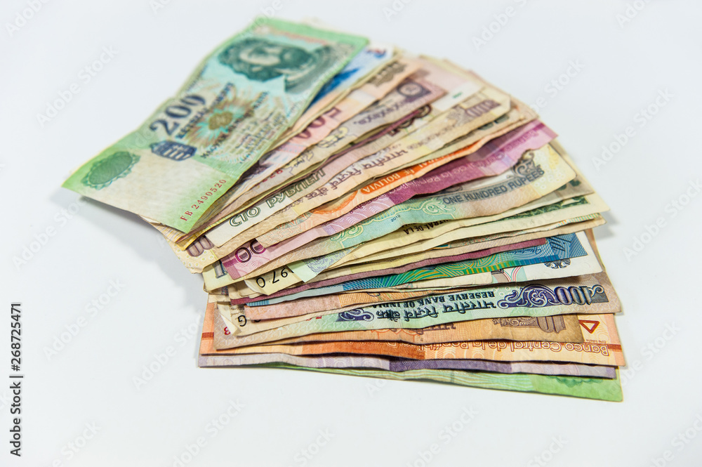 Fanned colorful international money bills on white background Fanned colorful international money bills on white background