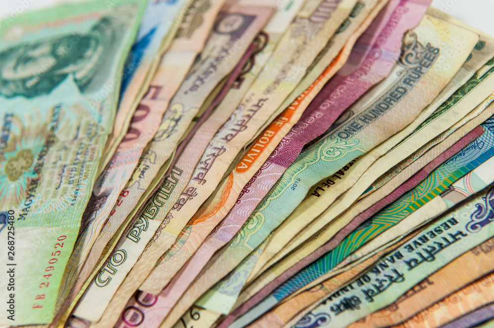 Fanned colorful international money bills closeup Fanned colorful international money bills closeup