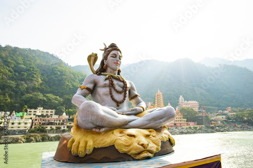 Wallpaper Mural Stunning view of the statue of sitting Lord Shiva on the riverbank of the Ganges river