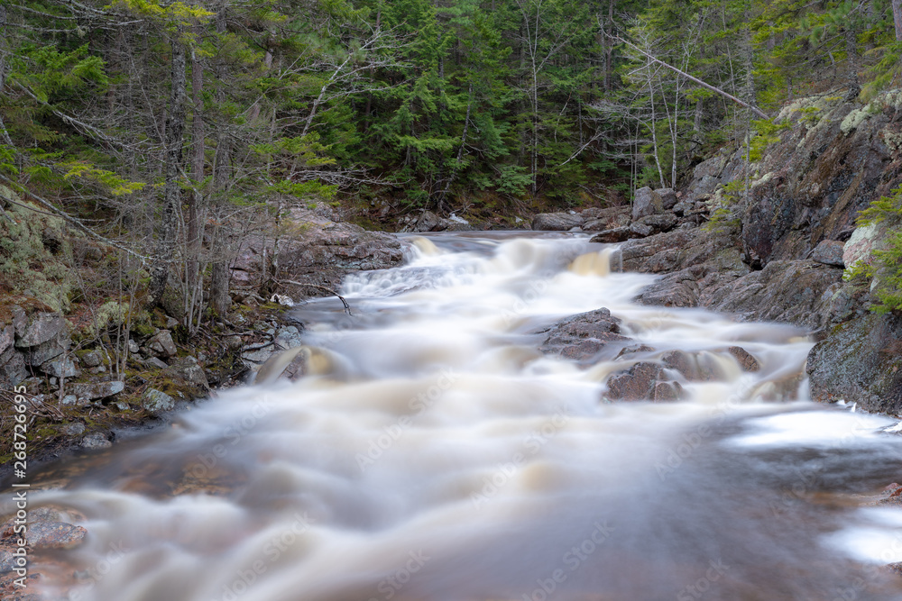 Long exposure of rapids in a river. The long exposure results in a fog like effect for the water. Rock and forrest around the water. Long exposure of rapids in a river. The long exposure results in a fog like effect for the water. Rock and forrest around the water.