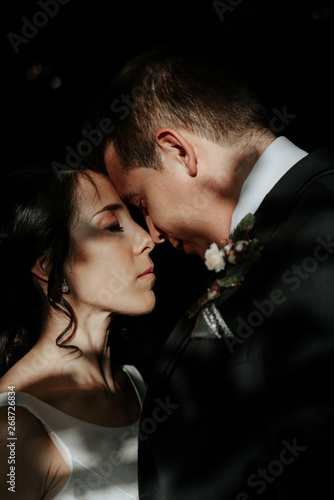 Very beautiful wedding of amazing couple in the park, gently hugging © Vasyl Dovhun