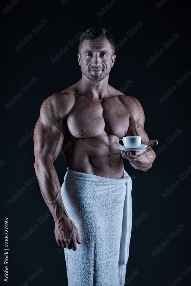 Athlete with six pack and ab muscles. Sport and fitness. Body hygiene concept. Bodybuilder naked body. Morning coffee. Sexy sportsman wipe body towel after shower. Man muscular fit bare torso Athlete with six pack and ab muscles. Sport and fitness. Body hygiene concept. Bodybuilder naked body. Morning coffee. Sexy sportsman wipe body towel after shower. Man muscular fit bare torso