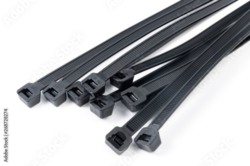Black nylon cable ties on a white background