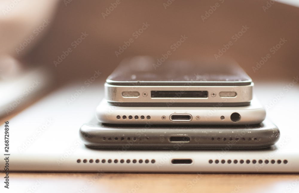 Stack of old apple phones Stack of old apple phones
