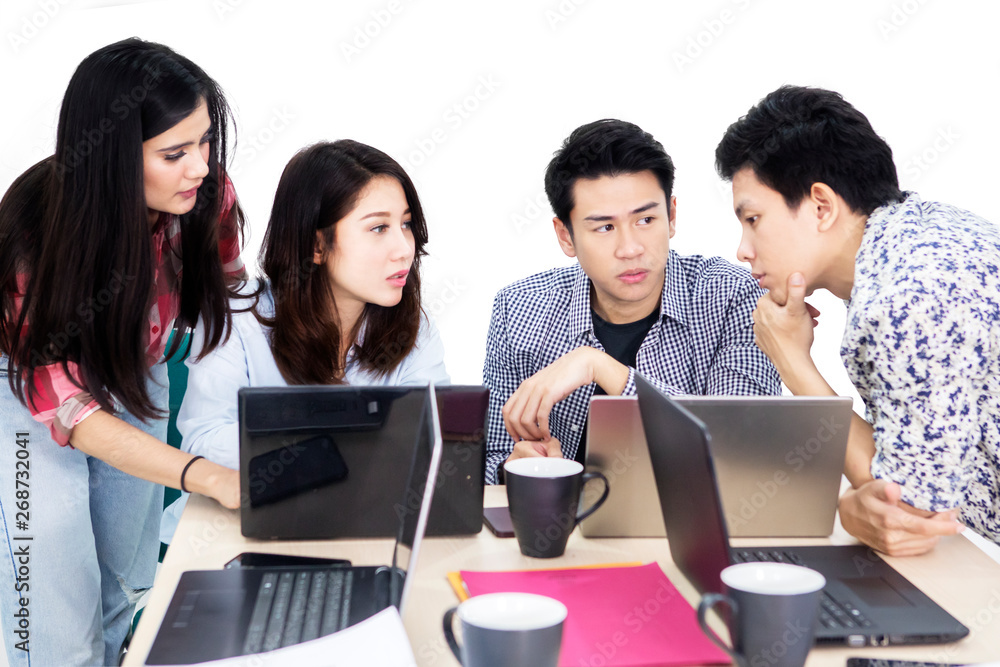 Four people discussing business strategy on studio Four people discussing business strategy on studio