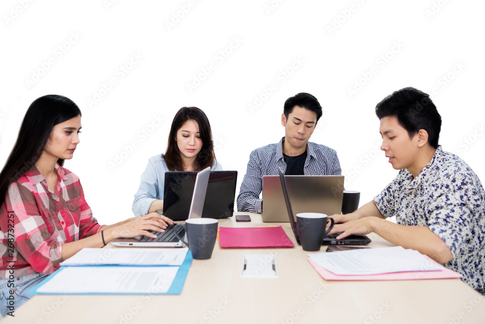 Group of young freelancer working in the studio Group of young freelancer working in the studio