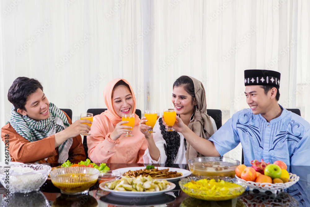 Happy people toast before breaks the fast together Happy people toast before breaks the fast together