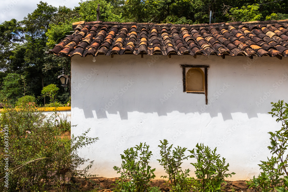 Tiradentes, Minas Gerais, Brazil - March 29, 2019: The simplicity of the dwellings in the rural area in the outskirts of the city of Tiradentes, interior of Brazil. Tiradentes, Minas Gerais, Brazil - March 29, 2019: The simplicity of the dwellings in the rural area in the outskirts of the city of Tiradentes, interior of Brazil.